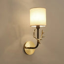 Antique brass antler wall sconce with fabric shade – bedroom light