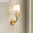 Antique brass antler wall sconce with fabric shade – bedroom light