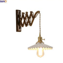 Antique brass ceramic walnut wall sconce with scalloped shade bedroom