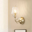 Antique brass conical sconce light with clear twisted glass bedroom