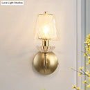 Antique brass conical sconce light with clear twisted glass bedroom