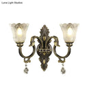 Antique brass floral wall sconce with metal base for bedroom
