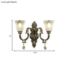 Antique brass floral wall sconce with metal base for bedroom