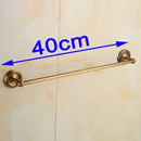Antique brass single towel bar with ornate base for bathroom decor