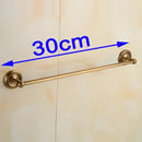 Antique brass single towel bar with ornate base for bathroom decor