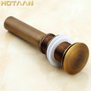 Antique brass sink drain with white rubber seal – bathroom waste