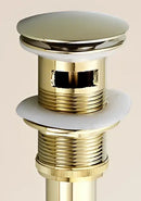Antique brass sink drain with white rubber seal – bathroom waste