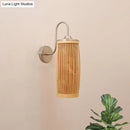 Asian bamboo and brass wall lamp with gooseneck arm – bedroom sconce