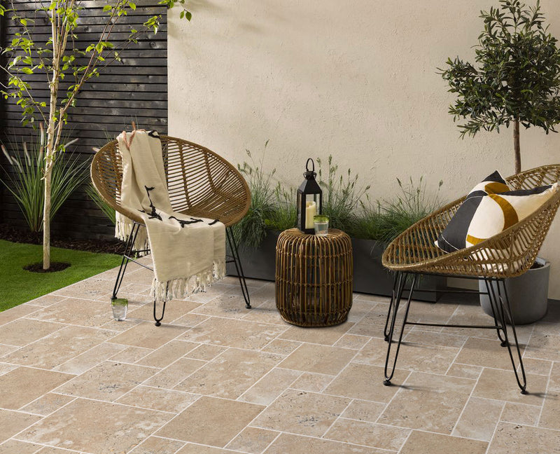 aspendos beige travertine pavers pattern installed on patio floor 2 chairs