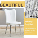 Table and chair set.63'x31.5x30' Luxurious Pandora patterned Sintered Stone Tabletop with Silver Stainless Steel Legs.Paried With 4 White PU Chairs with a vertical stripe design on the backrest.