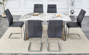 Table and chair set.63'x31.5x30' Luxurious Pandora patterned Sintered Stone Tabletop with Silver Stainless Steel Butterfly Legs.Paried With 6 Dark Gray High-quality PU Chairs With Arched Metal Legs.