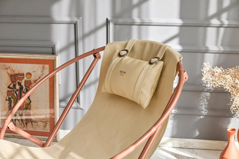 beige foldable metal frame faux leather chair product shot closeup view