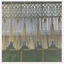 Beige handwoven macrame window curtain with tassels – living room