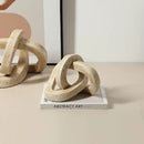 Beige speckled geometric interlocking loop knot living room sculpture