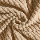 Beige textured quilted sofa cover with pillows for living room