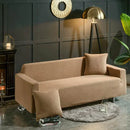 Beige textured quilted sofa cover with pillows for living room