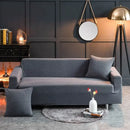 Beige textured quilted sofa cover with pillows for living room