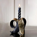 Black and gold banana candlestick holder for dining room decor