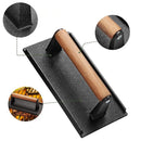 Black and light brown cast iron burger press kitchen meat tool