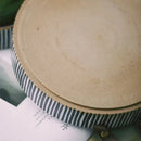 Black and white striped porcelain bowl with leather handle dining room