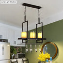 Traditional black island light fixture with wine glass holders kitchen