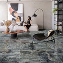black leopard marble tile 24x24 installed on living room floor black dressed woman patting cat on white couch