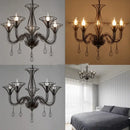 Black wrought iron chandelier with teardrop pendants for dining room