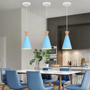 Blue matte metal pendant light with brass fixture for kitchens