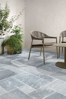 Bluestone Marble Pattern Tumbled Pavers - Full Truckload patio closeup view with wood chairs and plants