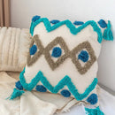 Boho square pillowcase with white zigzag and teal tassels living room