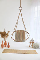 boves rast blue hanging round chair teak frame product shot orange vases wooden side table throw blanket