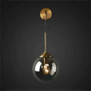 Brass amber glass ball wall light for bedroom and living room