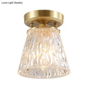 Brass semi flush mount with clear fluted glass for living room