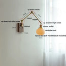 Brass walnut wall light with ribbed glass shade for bedroom