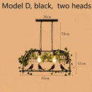 Bronze birdcage pendant lights with garland for dining room