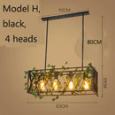 Bronze birdcage pendant lights with garland for dining room