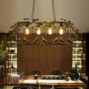 Bronze birdcage pendant lights with garland for dining room