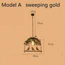 Bronze birdcage pendant lights with garland for dining room