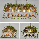 Bronze birdcage pendant lights with garland for dining room