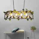 Bronze birdcage pendant lights with garland for dining room