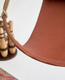 brown genuine leather hanging round chair teak frame product shot closeup edge-detail