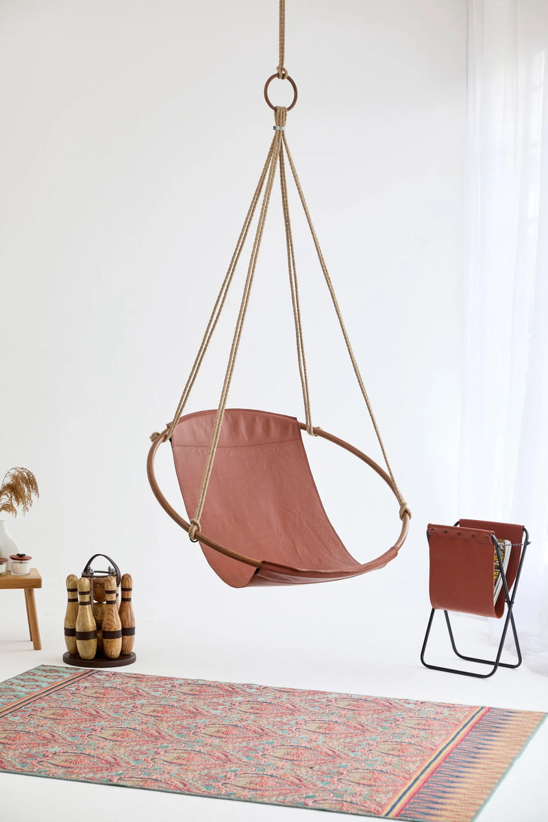 brown genuine leather hanging round chair teak frame product shot leather magazine holder wide view