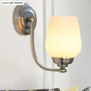 Brushed nickel milk glass wall lamp for stairways