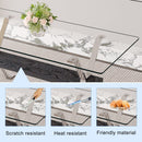 Table and chair set.Elegant Transparent Tempered Glass Dining Set - 71'x35.4' with 8 Black PU Chairs with a vertical stripe design on the backrest.