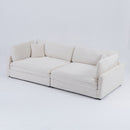 The 112-inch beige corduroy sofa, with two throw pillows and four backrests, has opened up a new style for the living room's leisure area