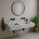 Calacatta Viola Marble Bathroom Double Sink Vanity (W)22" (L)67" (H)8" Polished  installed to a simple bathroom with round mirror plant on the corner and black wall-mount faucets