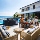Family enjoying a meal outdoors by a pool with ocean view