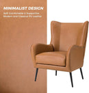 Faux Leather Wingback Chair With Black Nailhead Trim