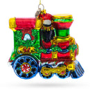 Playful Penguins Riding Train Glass Christmas Ornament