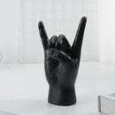 Chic black glossy rock hand gesture sculpture living room decor